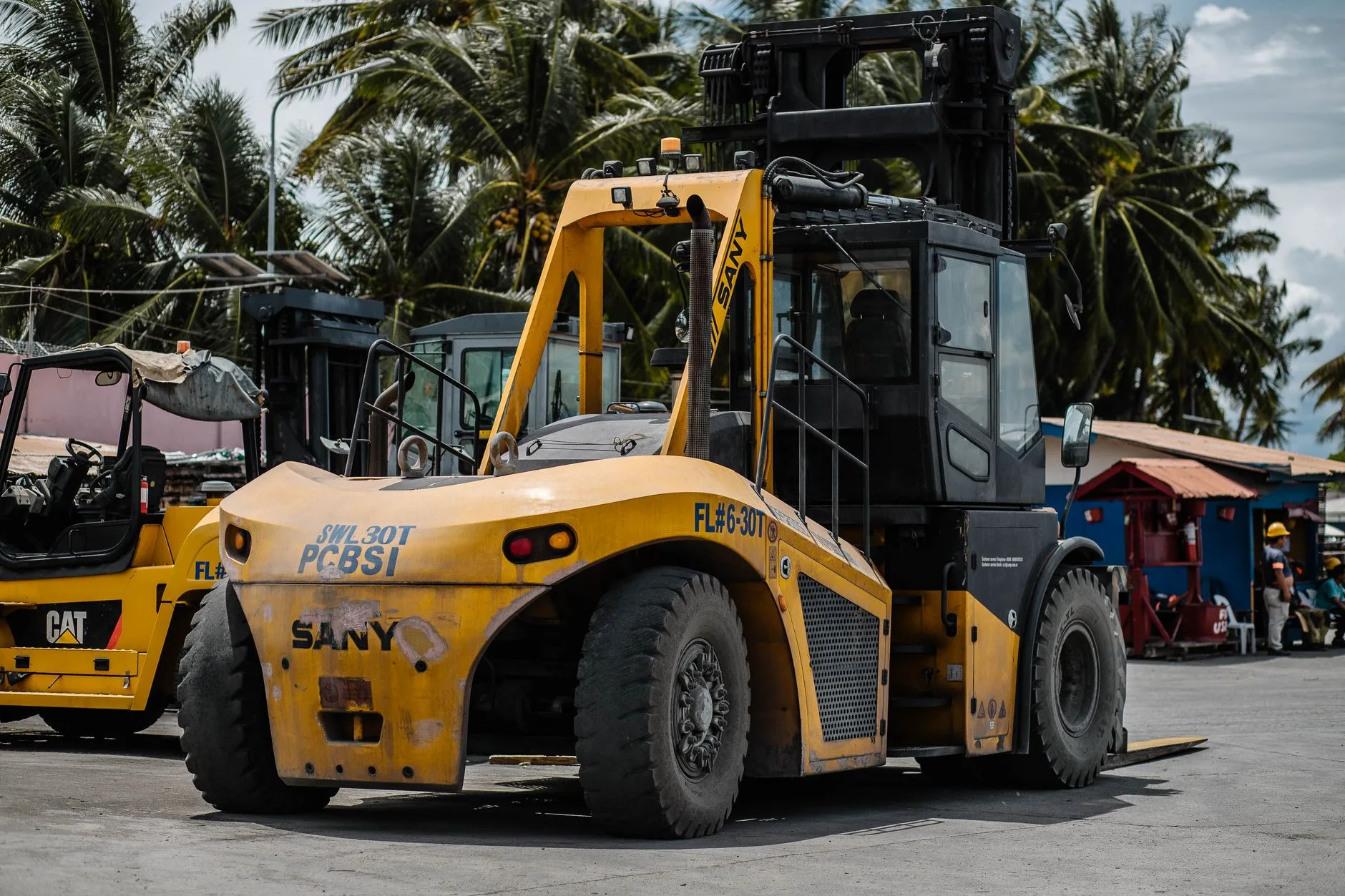 Heavy-duty 30-tonne forklift on industrial wheels parked in an outdoor yard