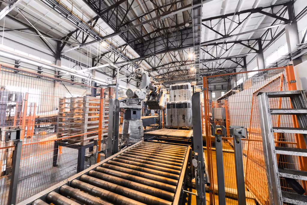 Industrial conveyor system using polyurethane rollers to reduce downtime