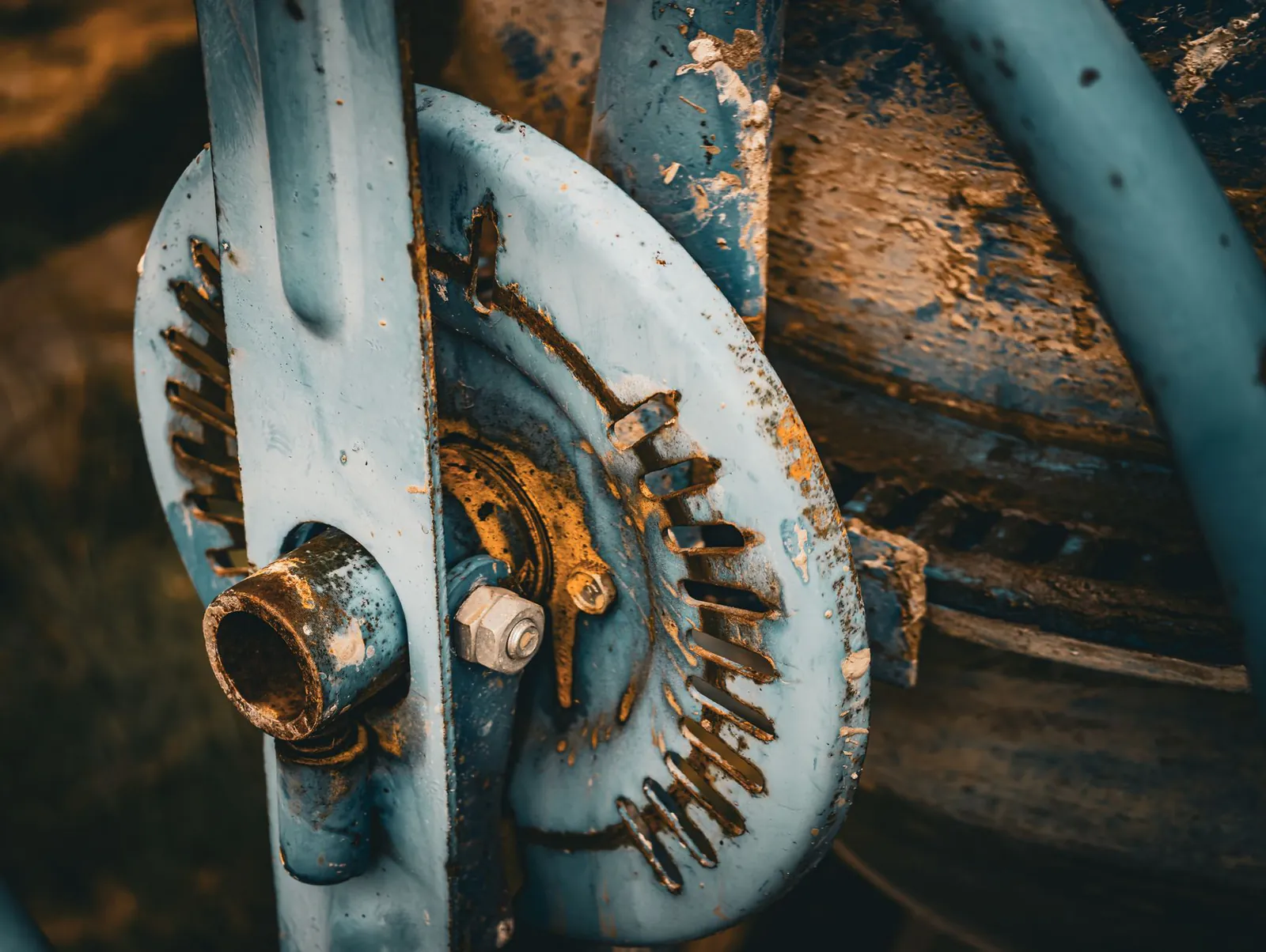 Corroded and worn steel mechanical part on industrial equipment